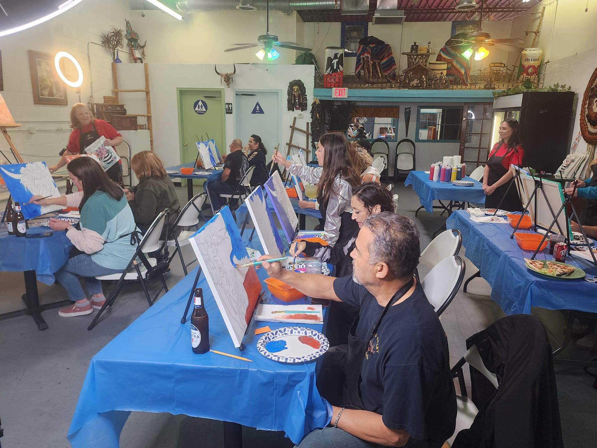 Bobbie teaching a lively painting class